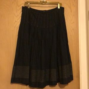 Black skirt with gold stitching pattern
